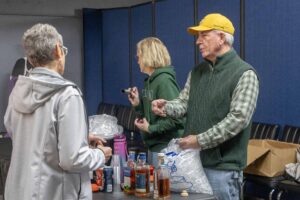 Mike Riley talks while pouring tastings for the Trip to Ireland Party